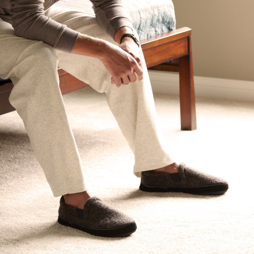 Men's Italian Wool Gore Moccasins on figure sitting on edge of bed indoors#color_charcoal-tweed
