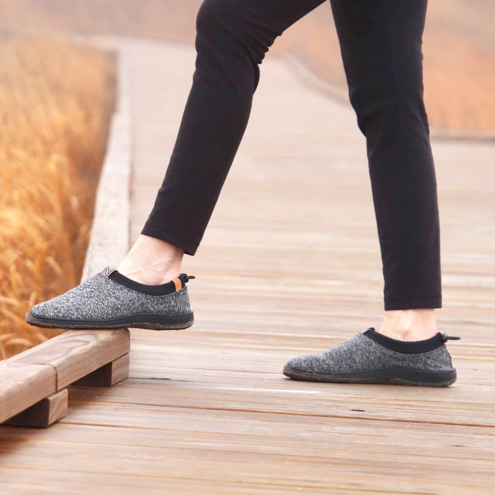Women's Explorer Adventure Moc on figure standing on board walk by beach#color_navy-heather
