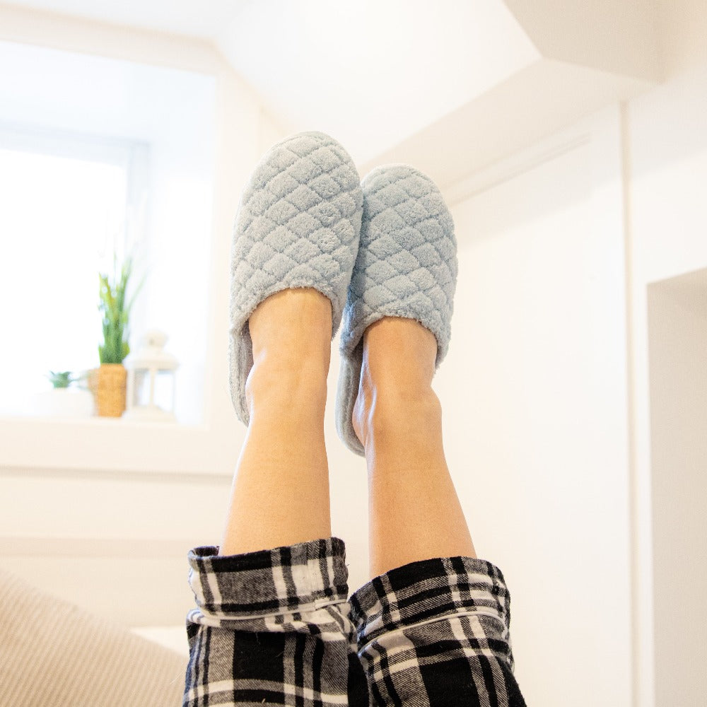 Women's Spa Quilted Clog in Powder Blue on figure with the model's feet in the air#color_powder-blue